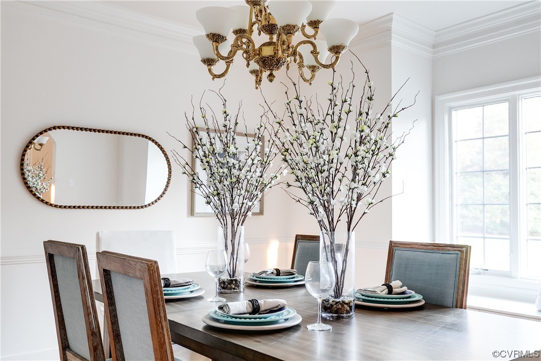 12110 Iron Forge Drive Midlothian, VA 23113 - Photo 7 of 50 a room with a table chairs and a chandelier