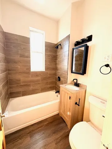 a bathroom with a sink a toilet and bathtub