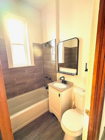 a bathroom with a toilet a sink and a bathtub