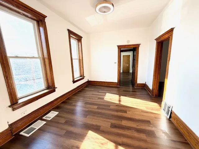 a view of front door with wooden floor