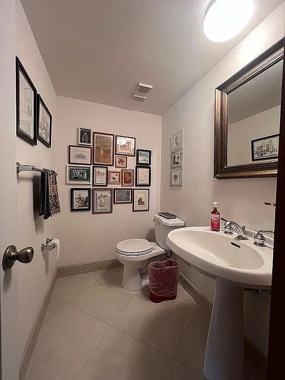 6463 La Costa Drive, Unit 105 Boca Raton, FL 33433 - Photo 16 of 40 a bathroom with a sink mirror and toilet