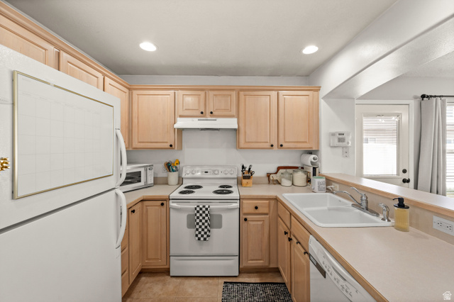 174 Rockey Park Lane, Unit 34 Draper, UT 84020 - Photo 6 of 20 Kitchen featuring white appliances, light wood finish cabinets, light countertops, a peninsula, and recessed lighting