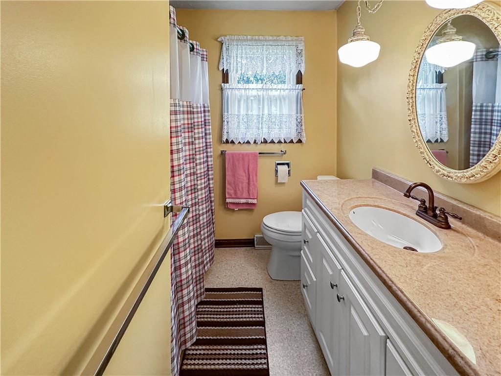 726 West Liberty Road Slippery Rock, PA 16057 - Photo 12 of 23 a bathroom with a sink a toilet and mirror