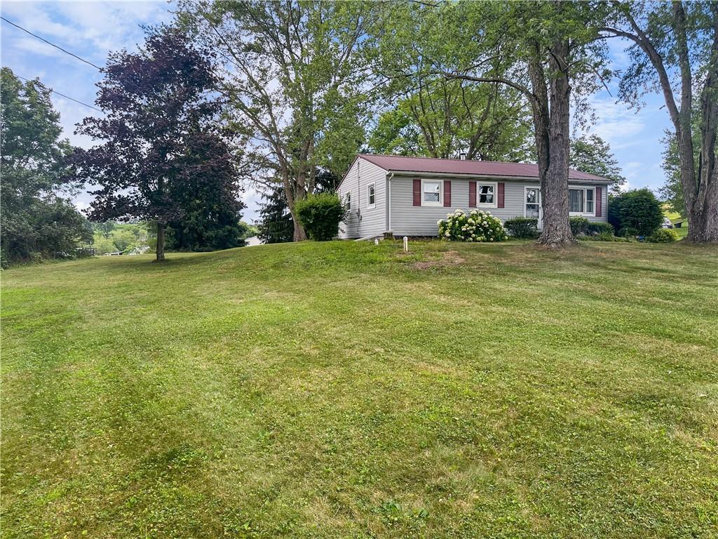 726 West Liberty Road Slippery Rock, PA 16057 - Photo 3 of 23 a front view of a house with a garden