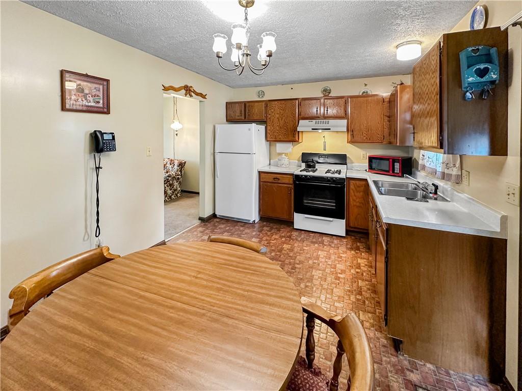 726 West Liberty Road Slippery Rock, PA 16057 - Photo 7 of 23 a large bedroom with a bed and a chandelier