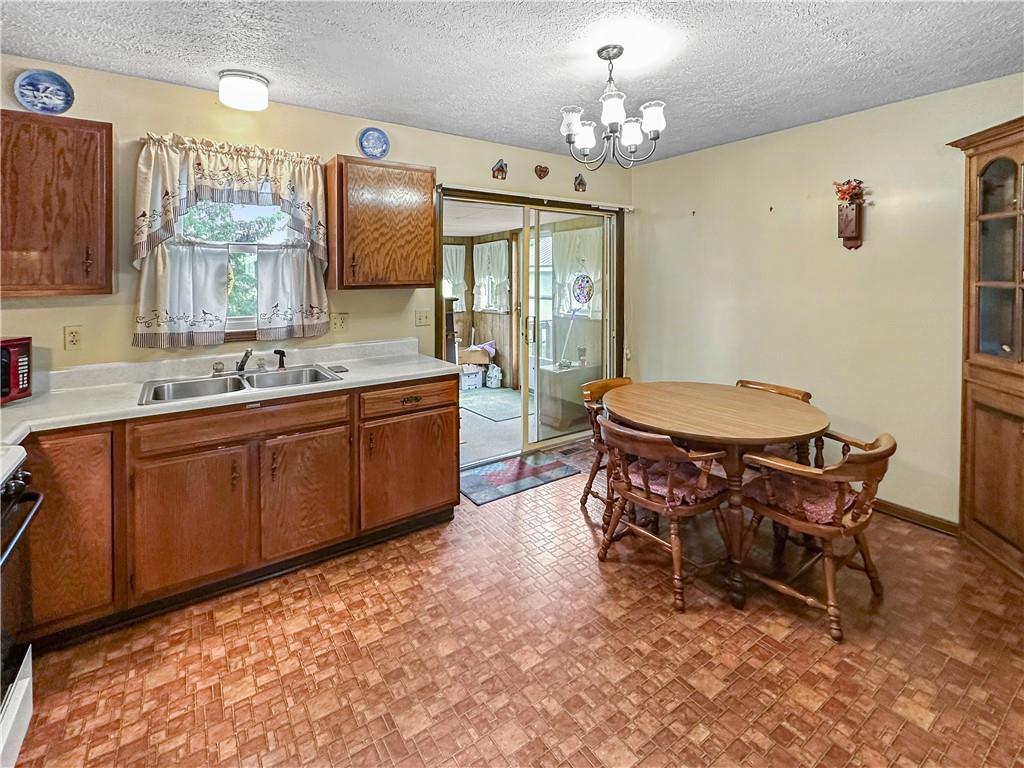 726 West Liberty Road Slippery Rock, PA 16057 - Photo 8 of 23 a room with chairs and view of kitchen
