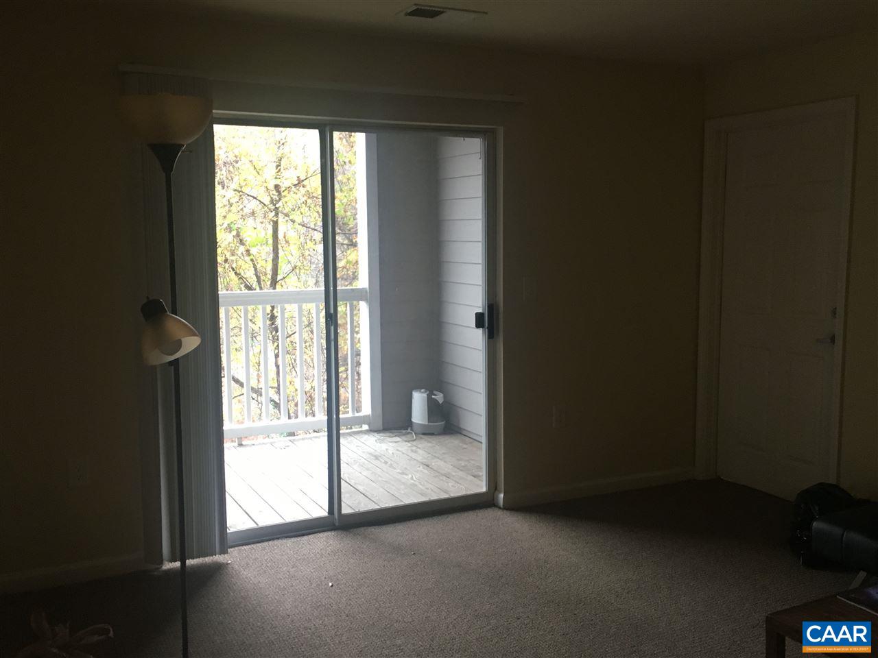 175 Yellowstone Drive, Unit 102 Charlottesville, VA 22903 - Photo 5 of 5 a view of an empty room and a window