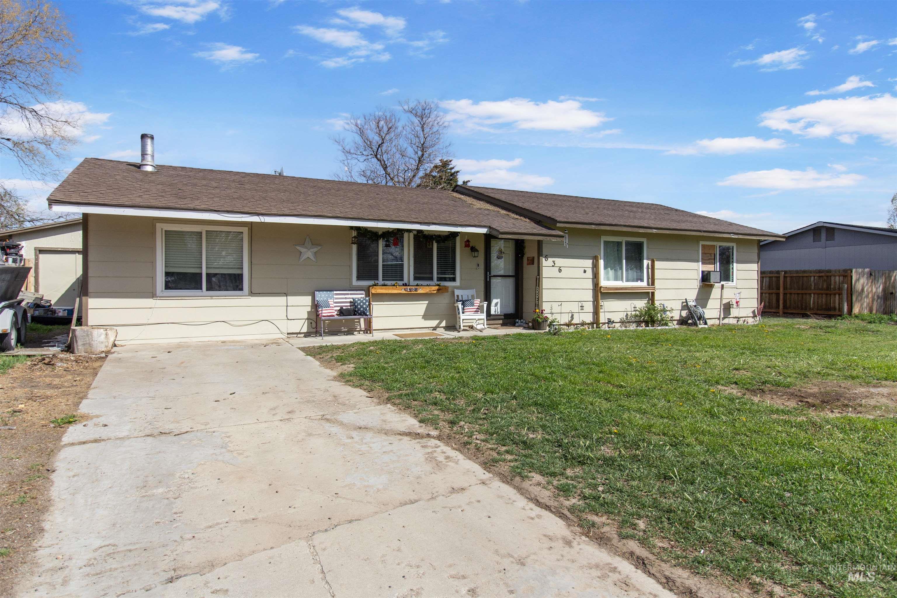 636 Main Street Hansen, ID 83334 - Photo 27 of 37 Single-story residence featuring light-colored siding and a brown shingle roof