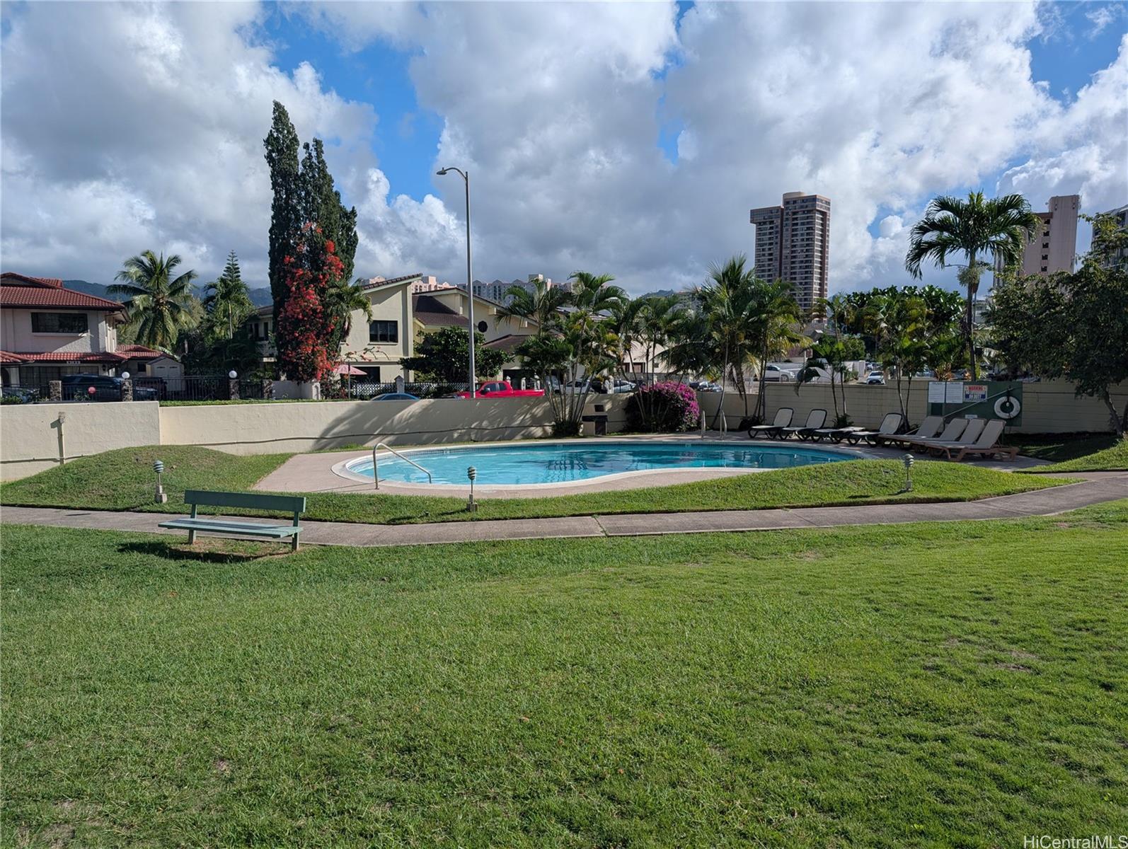 3130 Ala Ilima Street, Unit 10A Honolulu, HI 96818 - Photo 7 of 13 a view of a fountain in front of a house