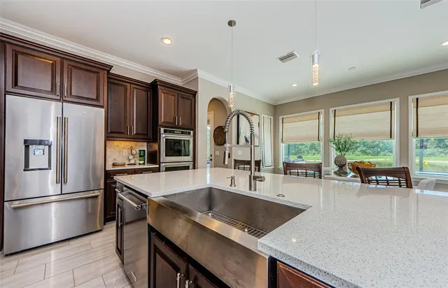 a living room with furniture or couches and a potted plant