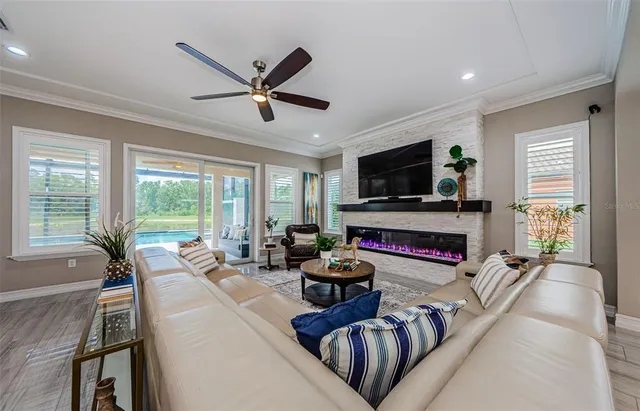a view of a room with furniture and wooden floor