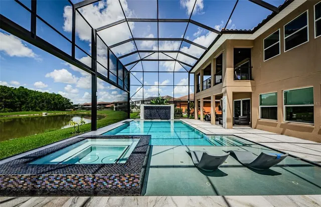 a living room with a black furniture and a flat screen tv