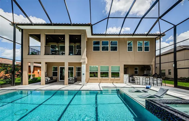 a view of a patio with chairs and plants