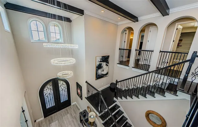 a large bathroom with a double vanity sink a large mirror and a bathtub