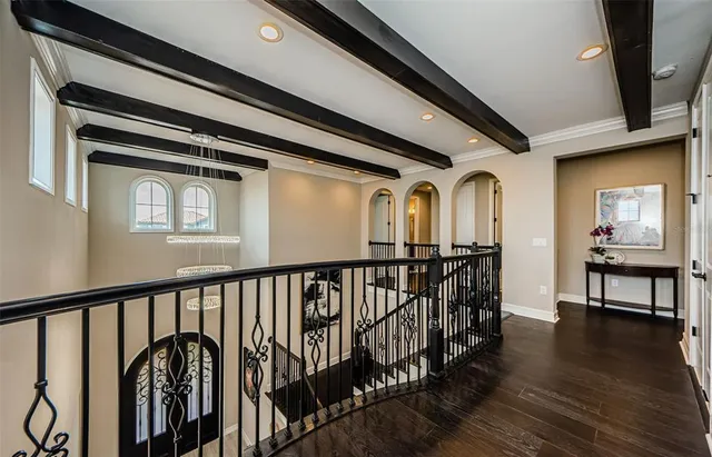 a large living room with stainless steel appliances kitchen island granite countertop a large counter top cabinets and a window