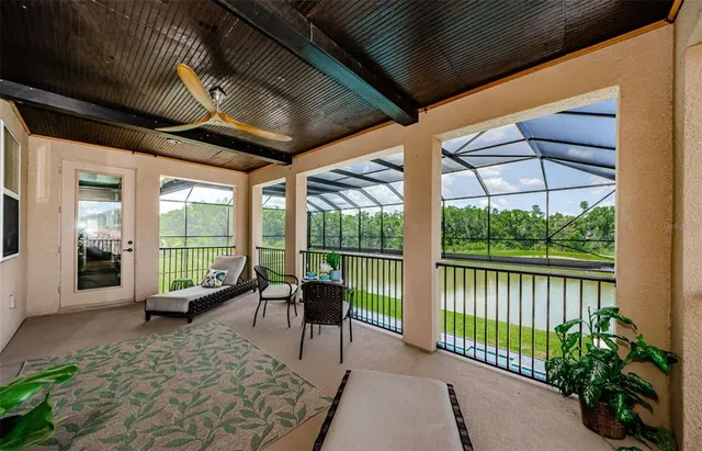 an outdoor space with seating area and sign board