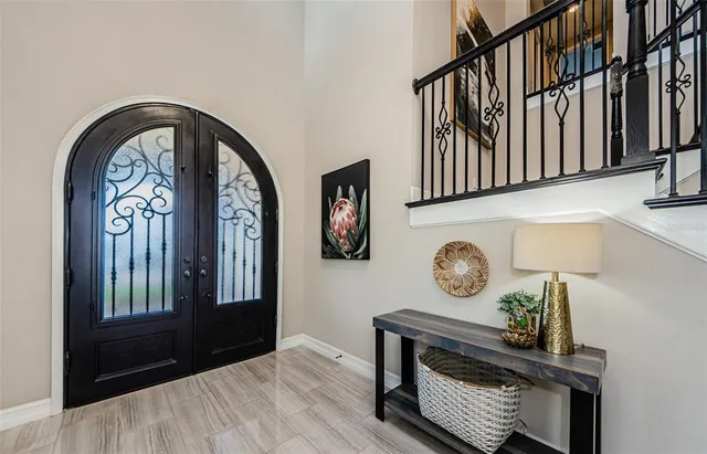 a view of entryway livingroom and hall with wooden floor