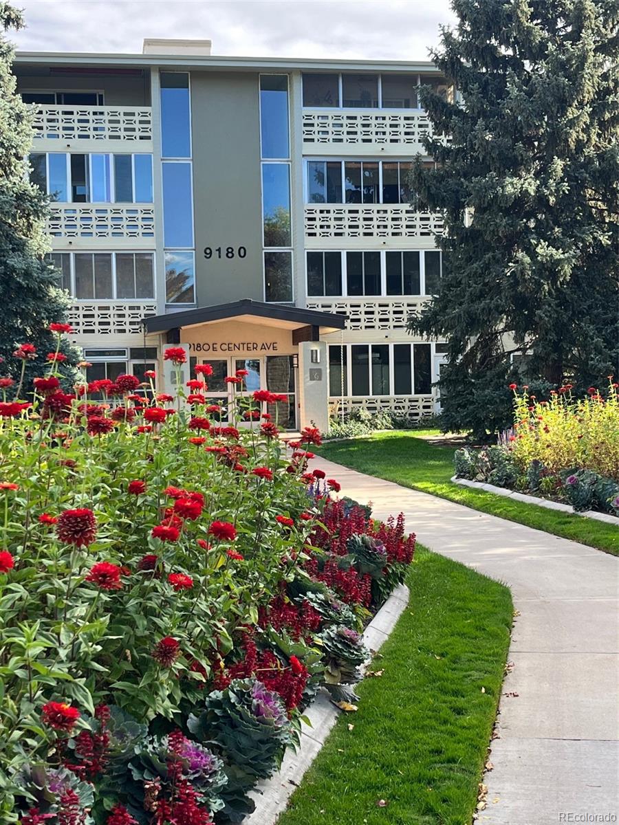 9180 Center Avenue, Unit 4D Denver, CO 80247 - Photo 19 of 19 a view of building with yard and entertaining space