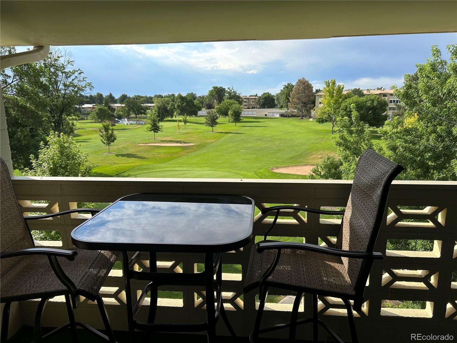 9180 Center Avenue, Unit 4D Denver, CO 80247 - Photo 9 of 19 a view of a dining room with furniture and wooden floor