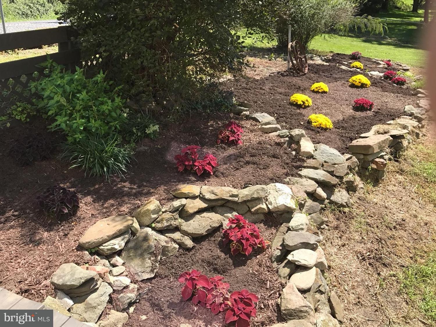 1050 Old Waynesboro Road Fairfield, PA 17320 - Photo 5 of 46 Nice landscaping and flower beds ads character..