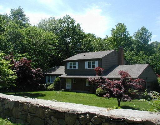 27 Fox Run Road Norwalk, CT 06850 - Photo 1 of 1 a front view of a house with a yard and garage