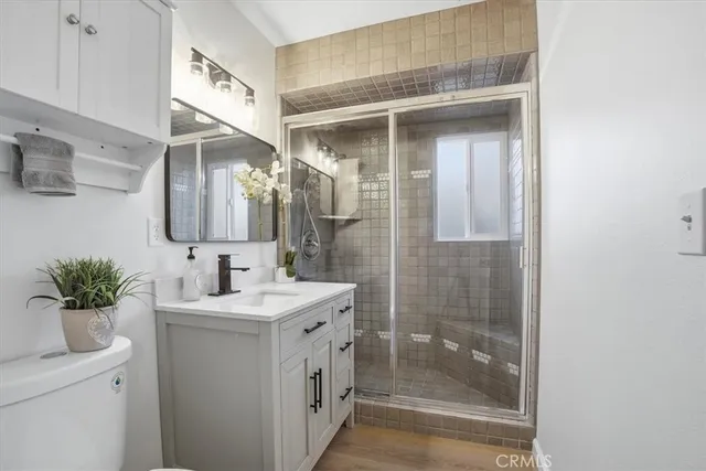 a bathroom with a sink a mirror and a shower