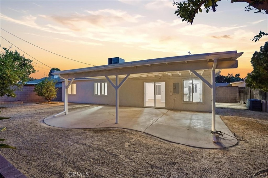 17751 Blythe Street Reseda, CA 91335 - Photo 21 of 23 a front view of a house with a yard