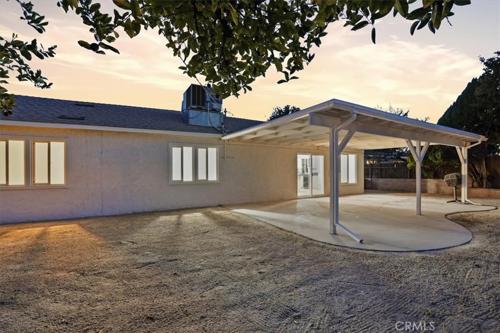 17751 Blythe Street Reseda, CA 91335 - Photo 4 of 23 a front view of a house with a yard