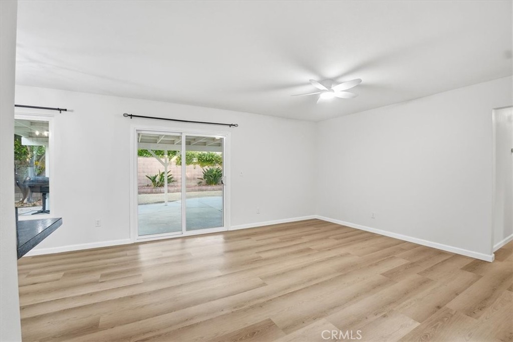 17751 Blythe Street Reseda, CA 91335 - Photo 6 of 23 wooden floor in an empty room with a window