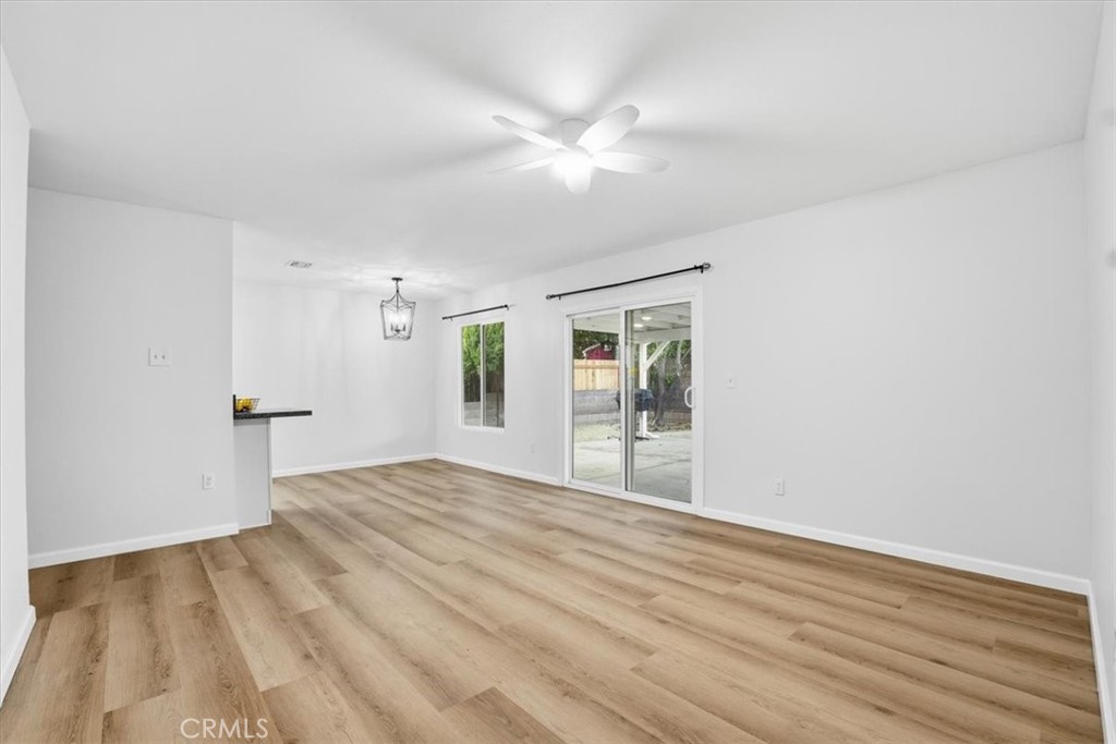 17751 Blythe Street Reseda, CA 91335 - Photo 8 of 23 a view of an empty room with window and wooden floor