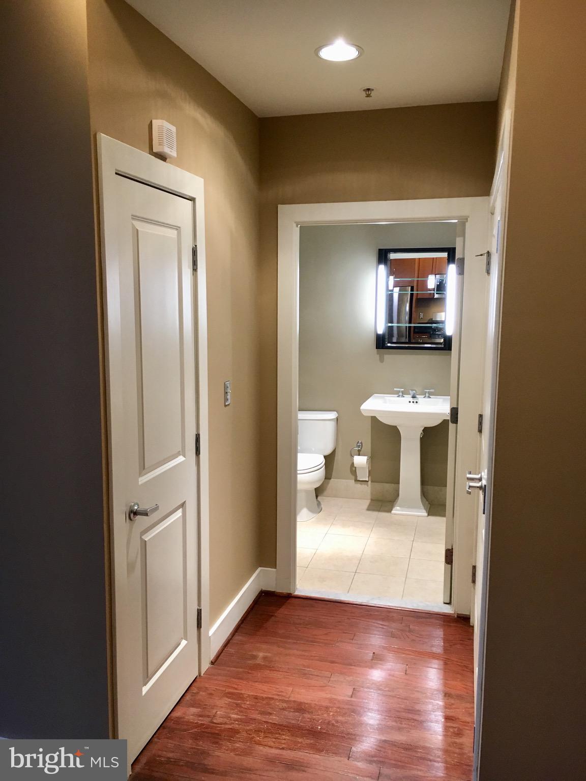 2301 Champlain Street Northwest, Unit 213 Washington, DC 20009 - Photo 11 of 40 a view of a bathroom from a hallway