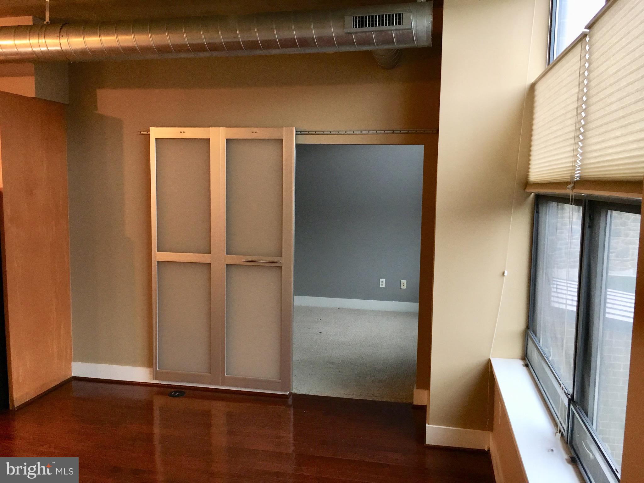 2301 Champlain Street Northwest, Unit 213 Washington, DC 20009 - Photo 13 of 40 a view of walk in closet with empty racks