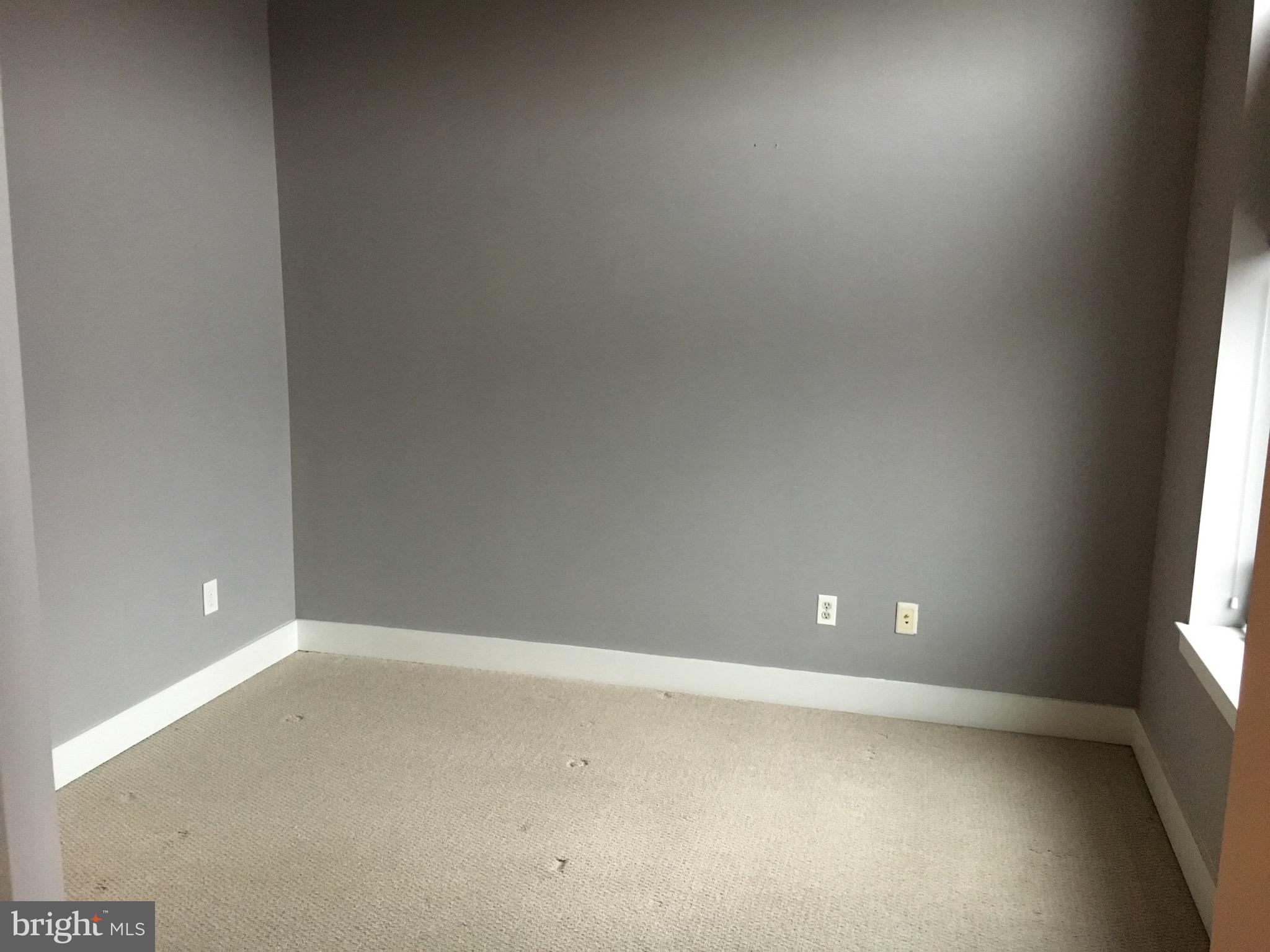 2301 Champlain Street Northwest, Unit 213 Washington, DC 20009 - Photo 14 of 40 a view of an empty room and window