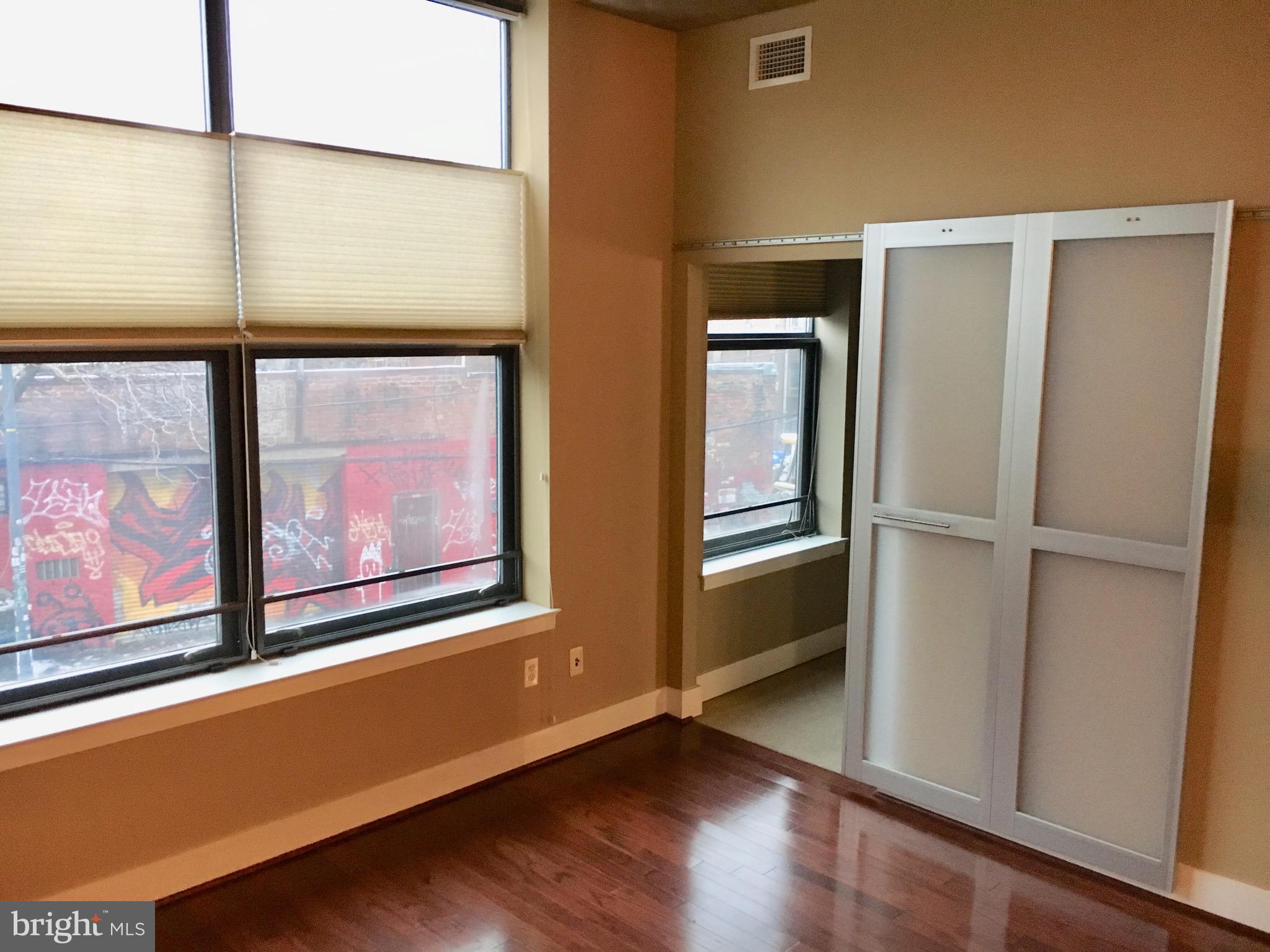 2301 Champlain Street Northwest, Unit 213 Washington, DC 20009 - Photo 22 of 40 a area with wooden floor and furniture