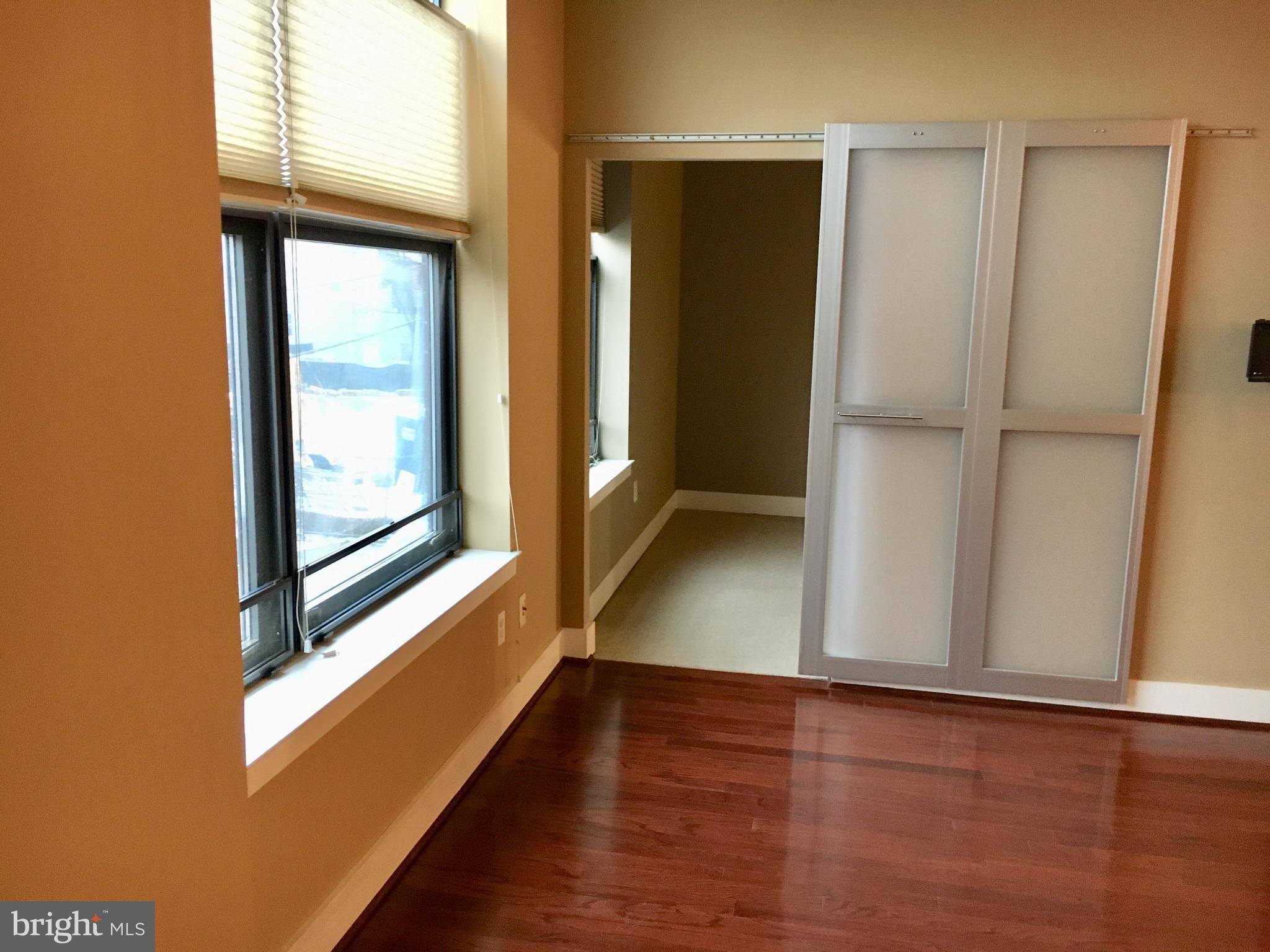 2301 Champlain Street Northwest, Unit 213 Washington, DC 20009 - Photo 23 of 40 a view of a hallway with wooden floor