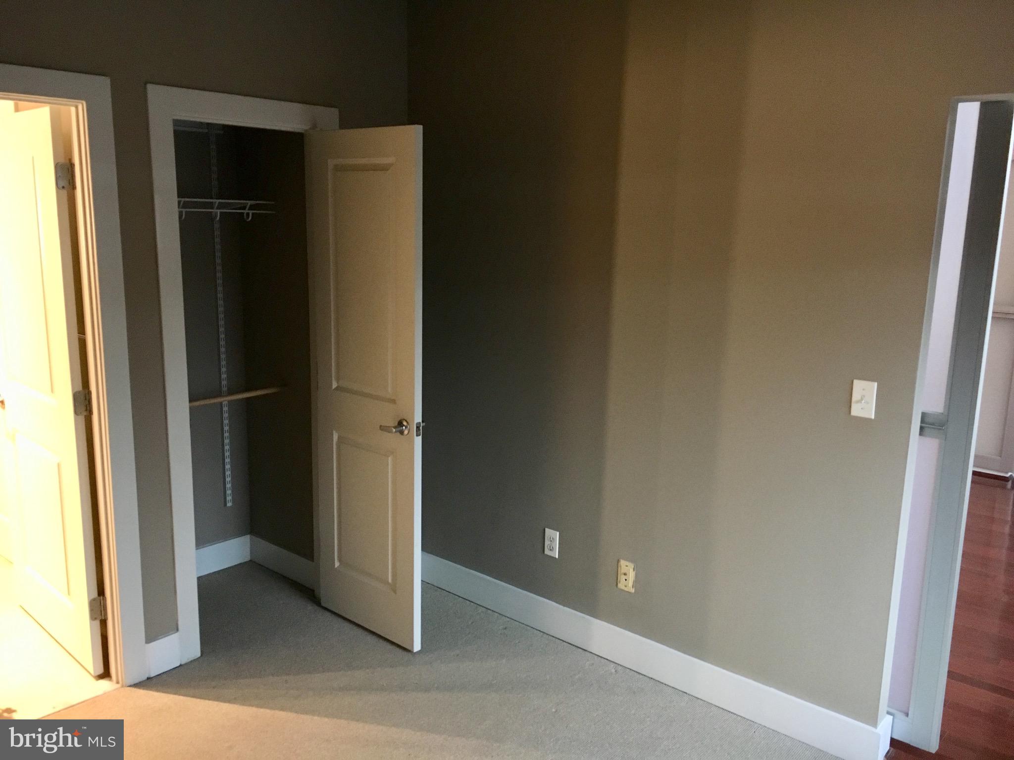 2301 Champlain Street Northwest, Unit 213 Washington, DC 20009 - Photo 26 of 40 an empty room with windows