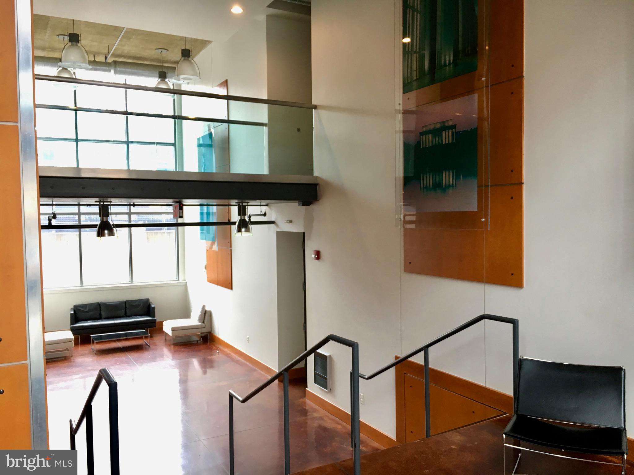 2301 Champlain Street Northwest, Unit 213 Washington, DC 20009 - Photo 32 of 40 a kitchen with a refrigerator a stove and a microwave