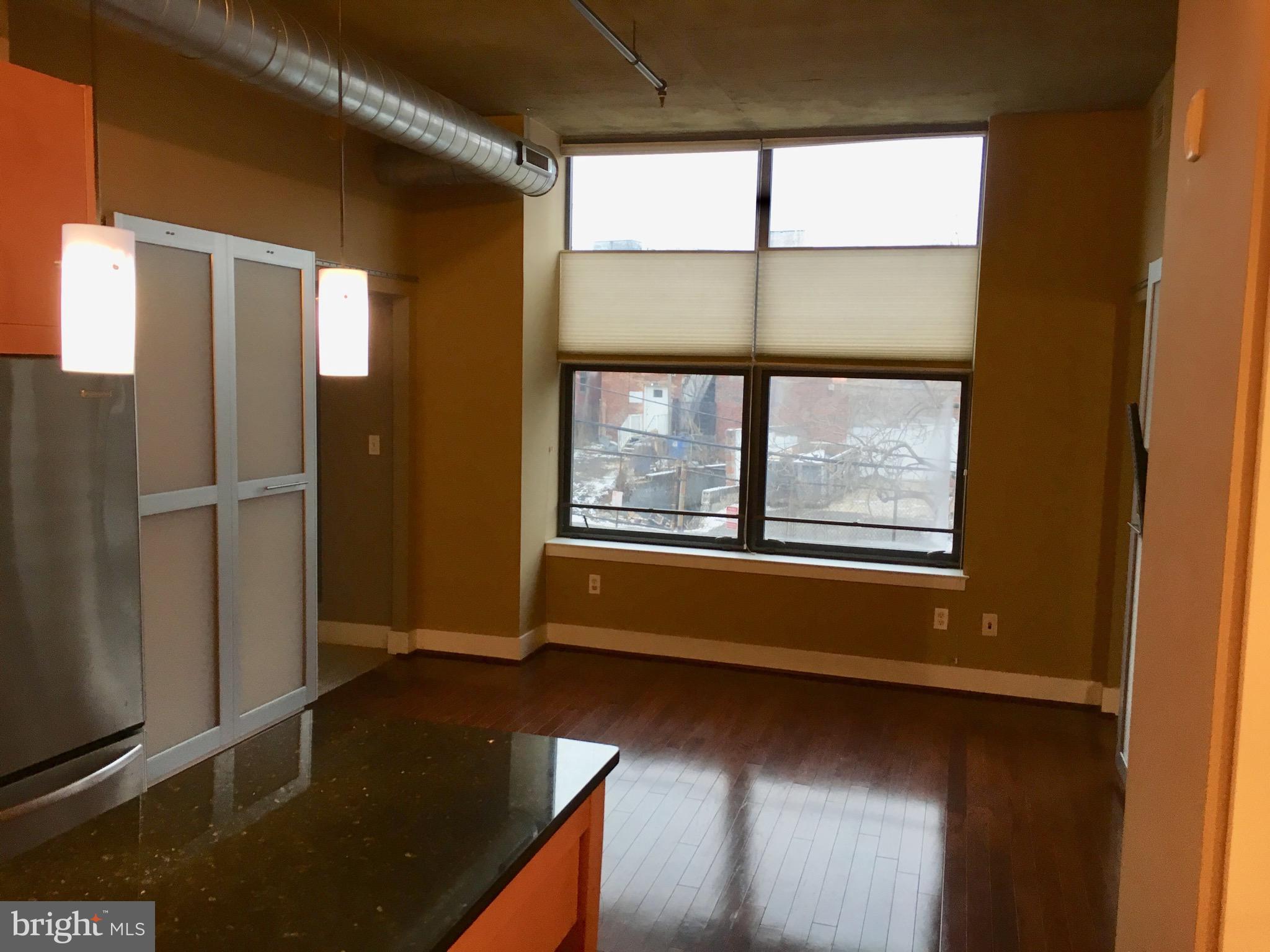 2301 Champlain Street Northwest, Unit 213 Washington, DC 20009 - Photo 8 of 40 a view of an empty room with a window