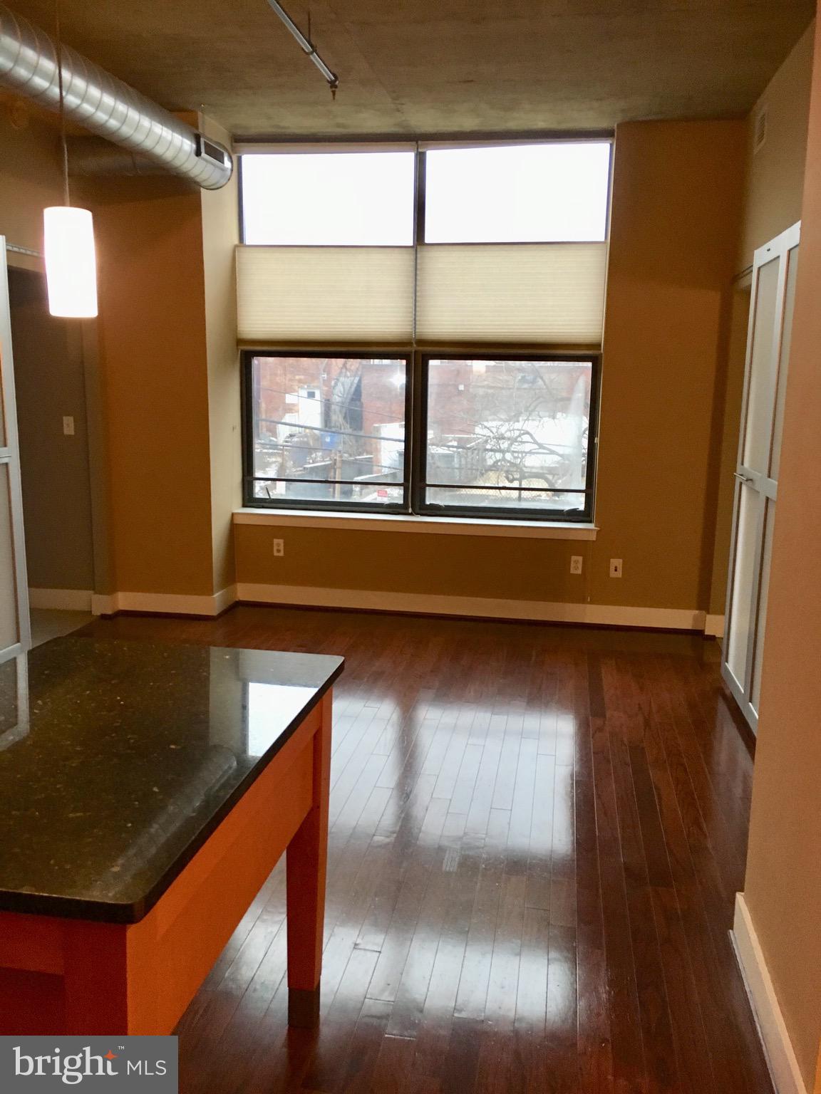 2301 Champlain Street Northwest, Unit 213 Washington, DC 20009 - Photo 9 of 40 a view of kitchen with wooden floor