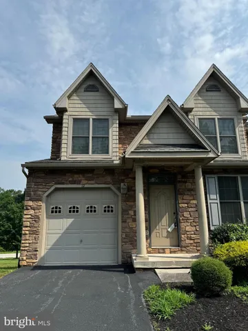 a front view of a house with a garage