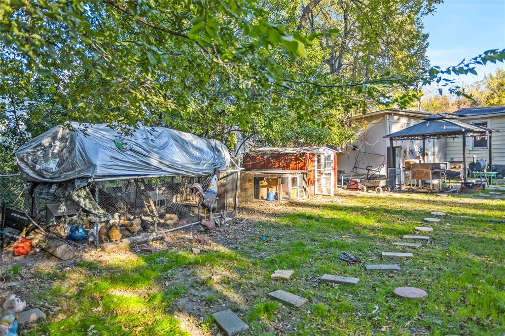 1641 Ben Davis Road Garland, TX 75040 - Photo 30 of 38 a view of a house with garden and a sitting area