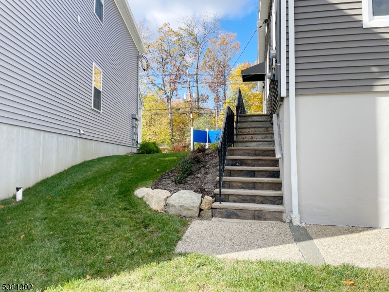31 Lakeside Boulevard, Unit A Hopatcong, NJ 07843 - Photo 22 of 24 a view of a house with a yard