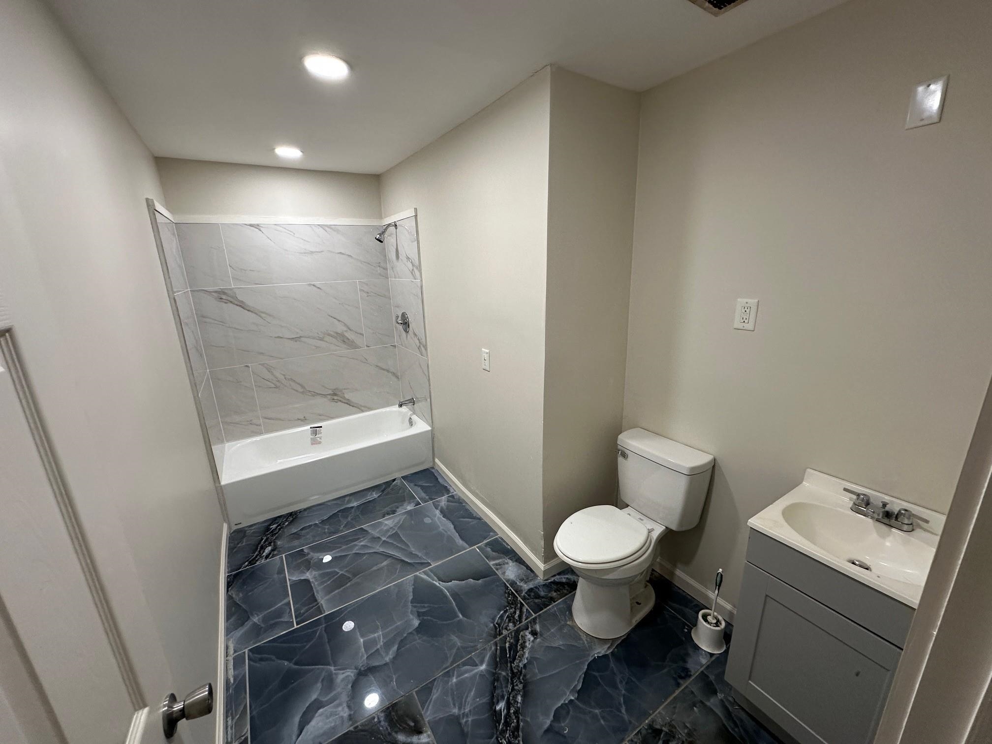 476 Mineral Road Memphis, TN 38120 - Photo 4 of 4 a bathroom with a sink and a toilet