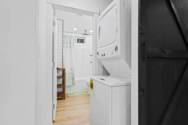 a utility room with cabinets washer and dryer