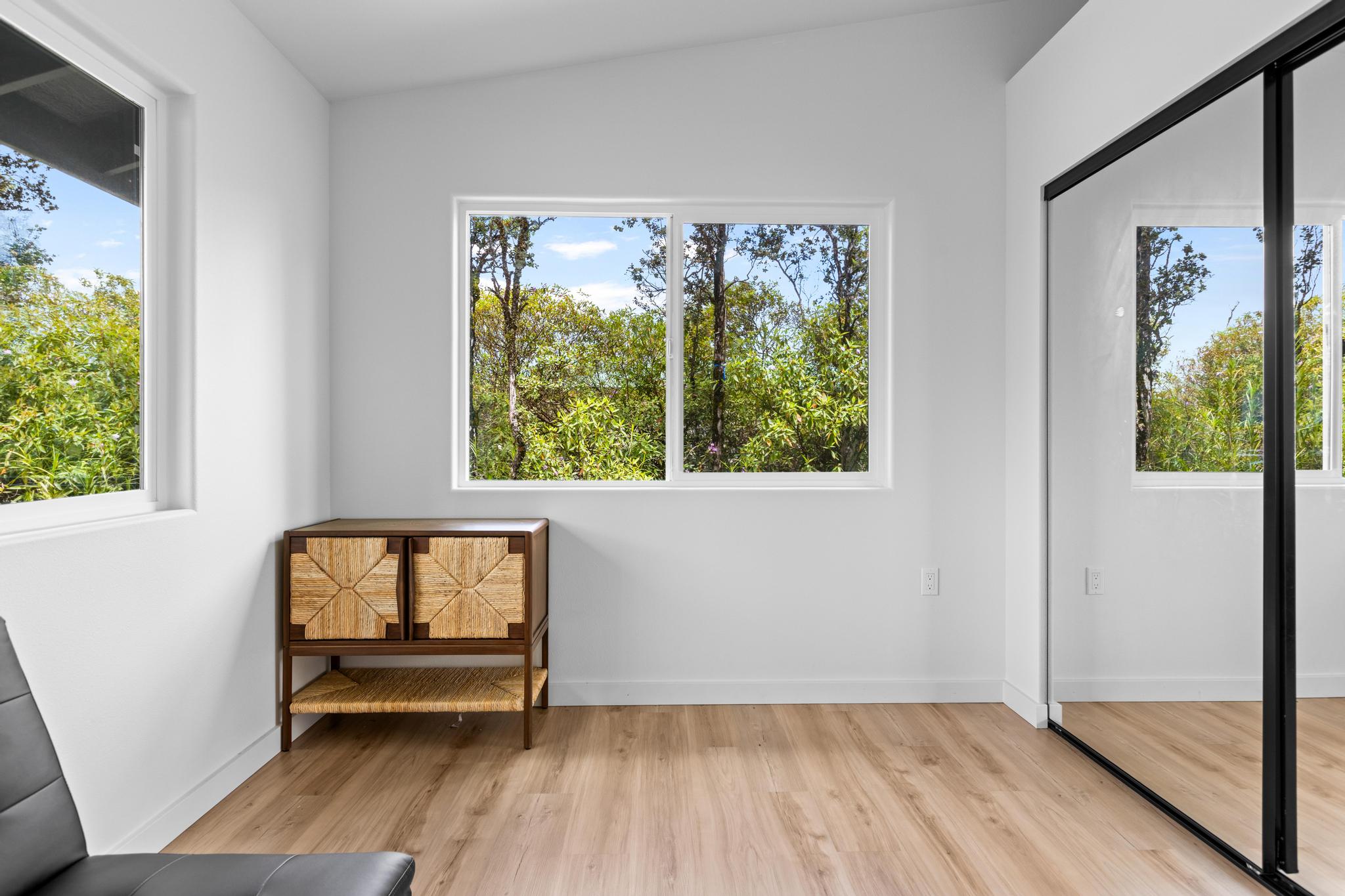 16-2075 Treefern Drive Pahoa, HI 96778 - Photo 13 of 24 a hallway with a window and wooden floor