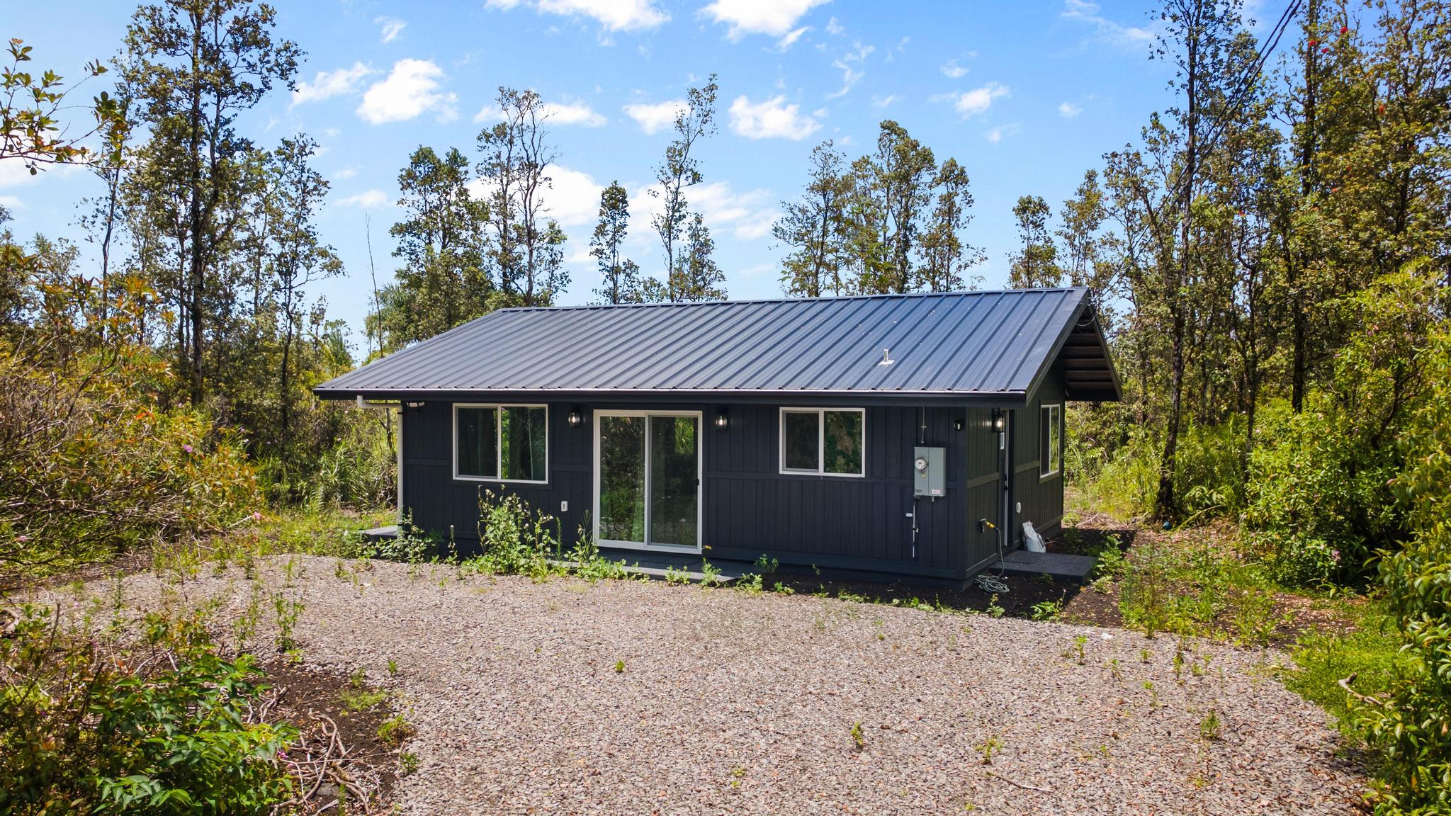 16-2075 Treefern Drive Pahoa, HI 96778 - Photo 19 of 24 a view of a house with a yard plants and large tree