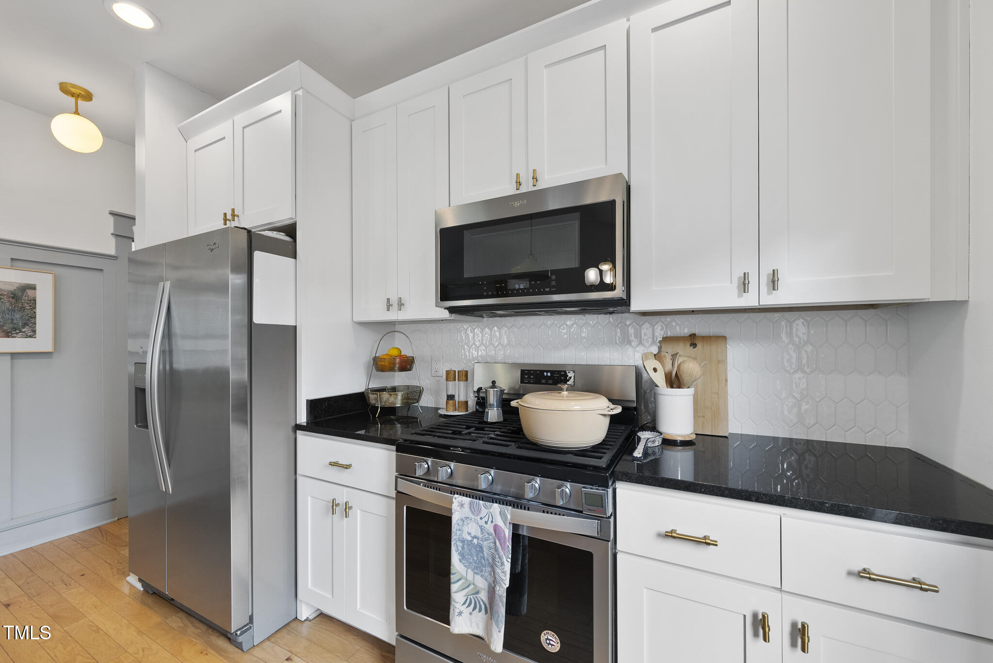 1010 South Person Street Raleigh, NC 27601 - Photo 11 of 41 a kitchen with stainless steel appliances granite countertop a sink stove and refrigerator