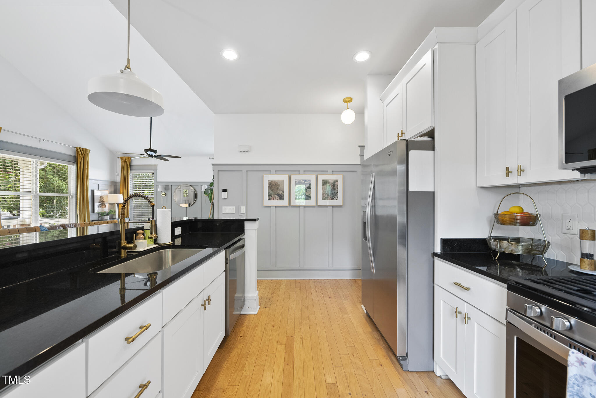 1010 South Person Street Raleigh, NC 27601 - Photo 12 of 41 a large kitchen with granite countertop a stove a sink dishwasher and a refrigerator