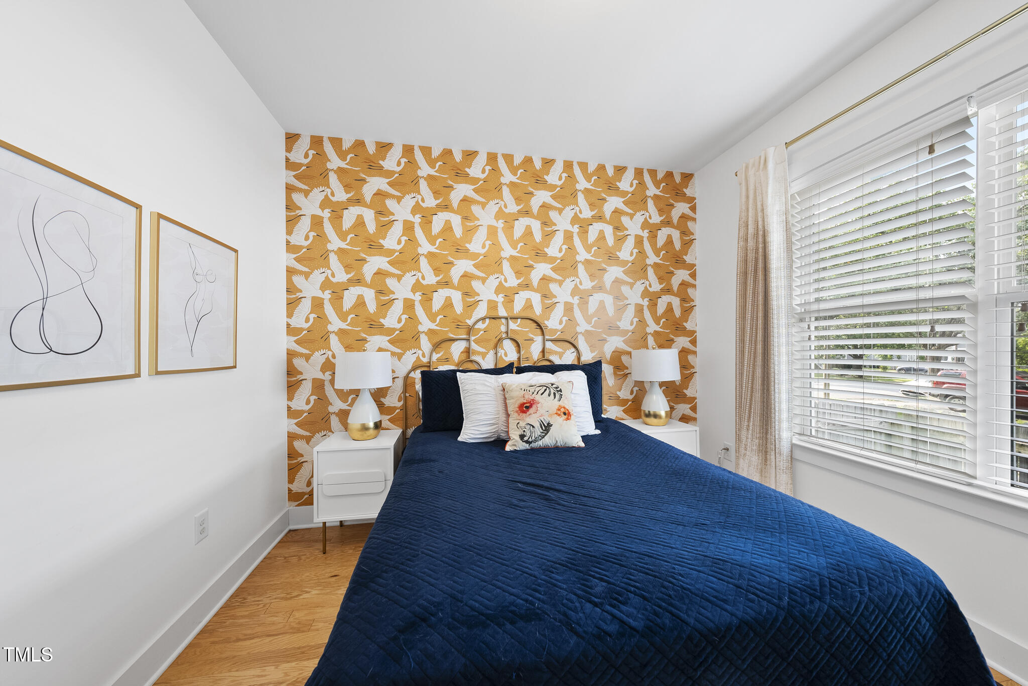 1010 South Person Street Raleigh, NC 27601 - Photo 14 of 41 a bed sitting in a bedroom next to a window