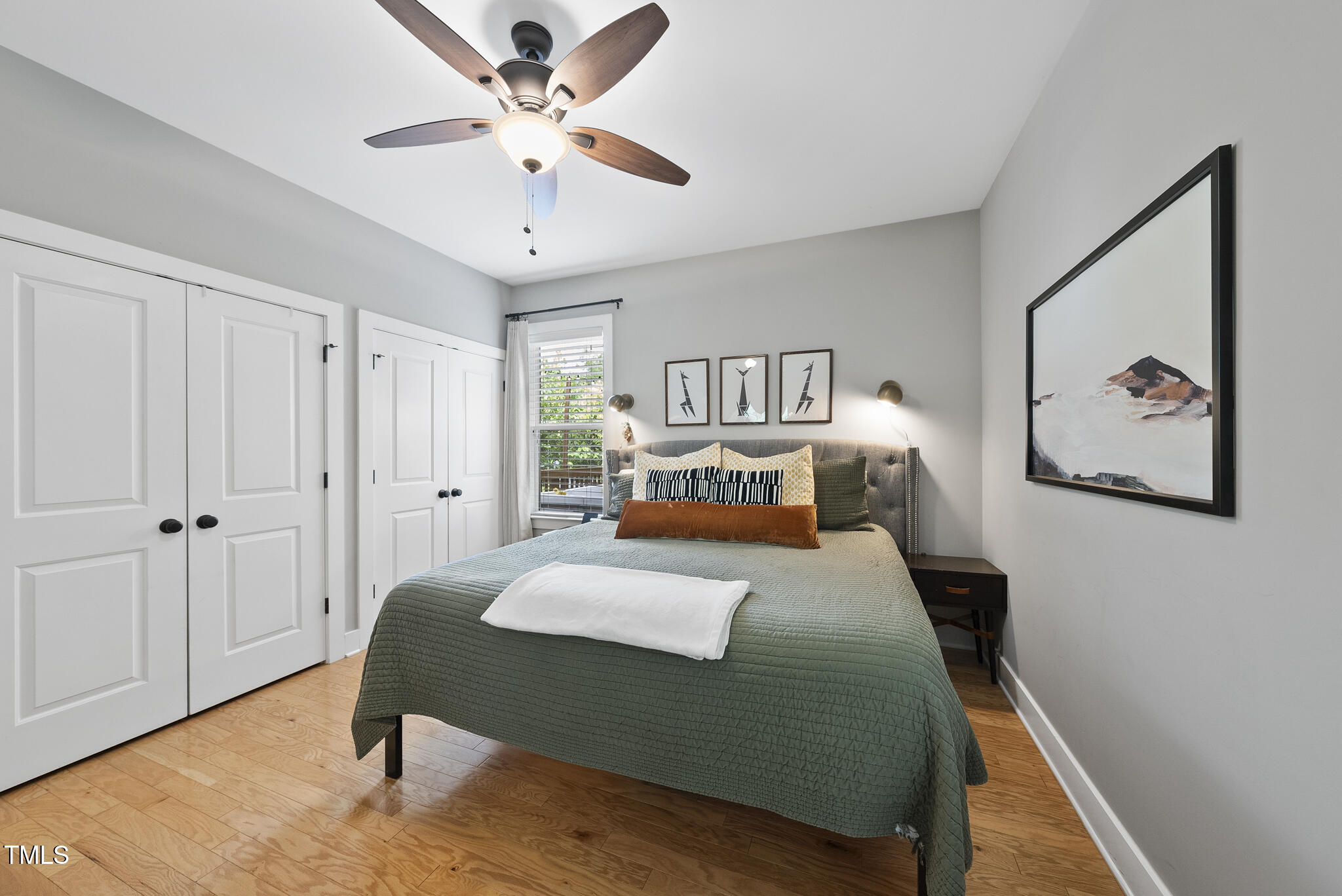 1010 South Person Street Raleigh, NC 27601 - Photo 16 of 41 a bedroom with a large bed and a chandelier